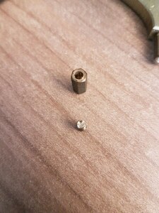 Metal stand-off with slot cut into thread