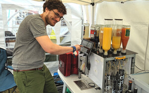 Steffen demonstrating the machine for Hackaday